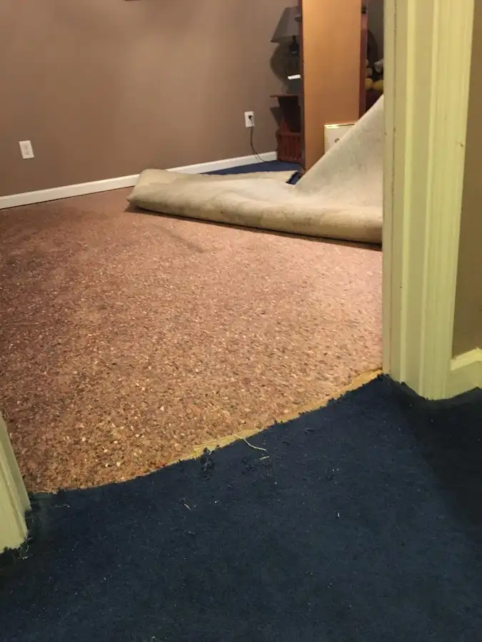 Carpet pad removal revealing water damage during Drying & Dehumidification in Aiea